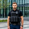 Охранник в бронежилете около бизнес-центра