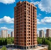 Строительство высотной монолитно-кирпичной новостройки в городе
