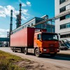 Автофура около промышленного здания в большом индустриальном комплексе
